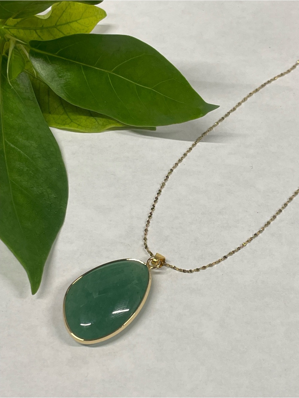Gold Necklace with Green Teardrop Pendant